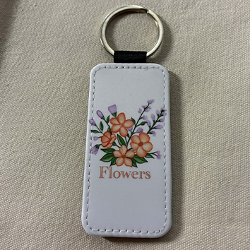 Porte clef cuir blanc et noir paillettes : flower